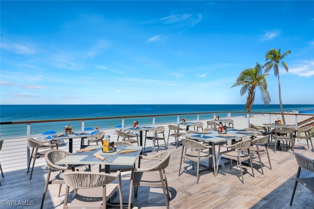 view of patio / terrace featuring a view of the beach and a water view