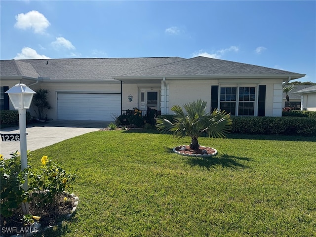 ranch-style home with a front lawn and a garage