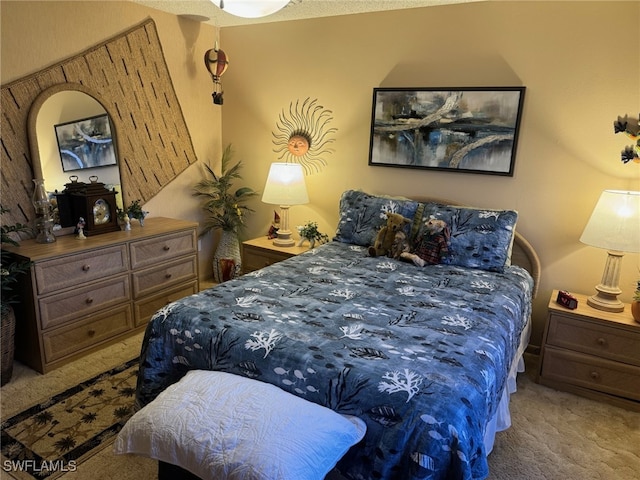 bedroom featuring carpet