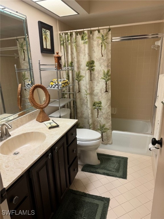 full bathroom with toilet, tile patterned flooring, vanity, a skylight, and shower / bath combo