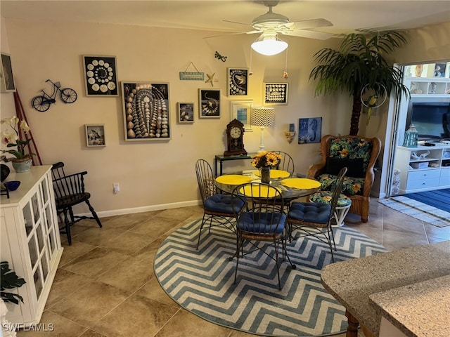 dining space with ceiling fan