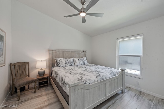 bedroom featuring vaulted ceiling, hardwood / wood-style flooring, and ceiling fan