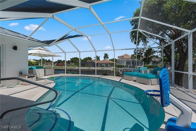 outdoor pool featuring a lanai and a patio area