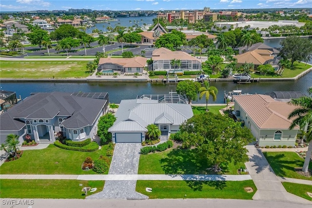 bird's eye view featuring a residential view and a water view