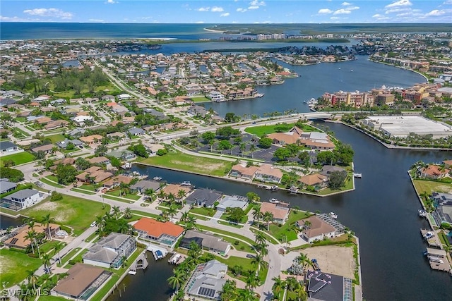 birds eye view of property featuring a water view and a residential view