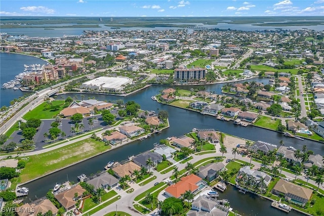 bird's eye view with a water view and a residential view