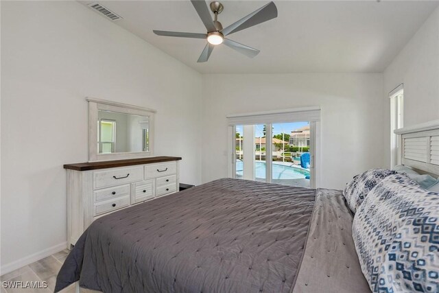 bedroom featuring ceiling fan, vaulted ceiling, and access to outside