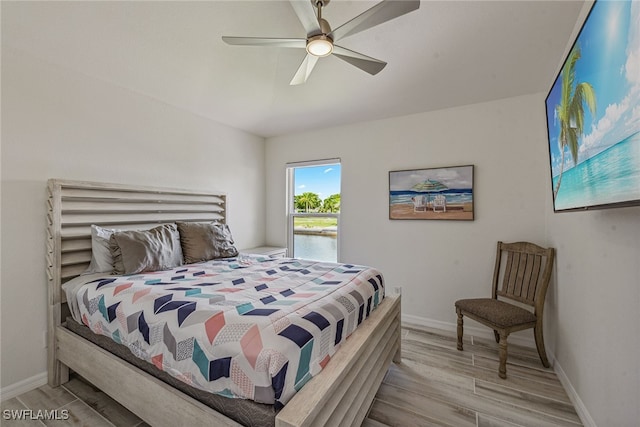 bedroom featuring ceiling fan and light hardwood / wood-style flooring