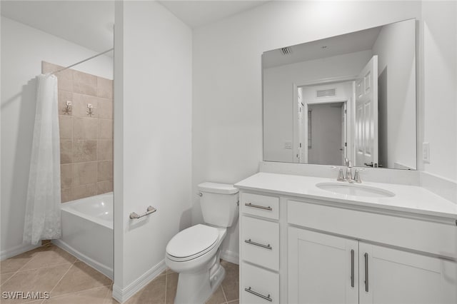 full bathroom featuring tile patterned floors, vanity, toilet, and shower / bath combo with shower curtain