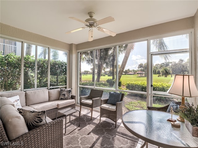 sunroom with ceiling fan and a wealth of natural light