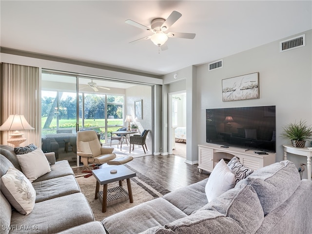 living room with hardwood / wood-style flooring and ceiling fan