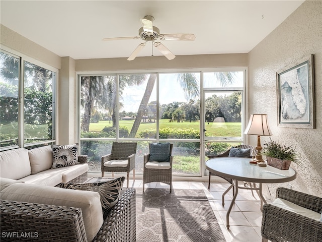 sunroom / solarium with ceiling fan and a healthy amount of sunlight