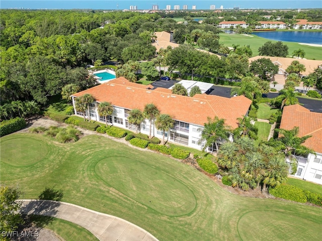 birds eye view of property with a water view