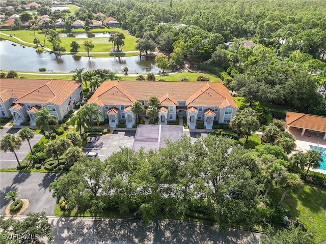 birds eye view of property featuring a water view