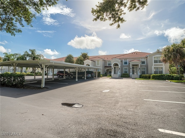 view of vehicle parking with a carport