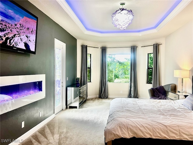 bedroom featuring light colored carpet, a raised ceiling, and crown molding