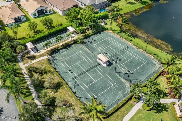 birds eye view of property with a water view