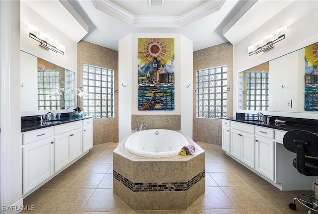 bathroom featuring vanity, tile patterned floors, plenty of natural light, and tiled bath