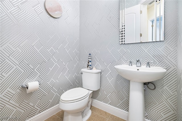 bathroom featuring tile patterned flooring and toilet