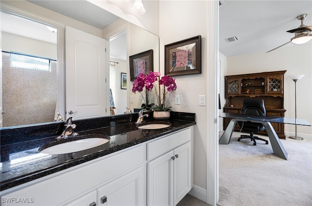 bathroom featuring ceiling fan and vanity