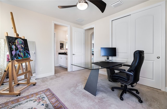 office featuring carpet and ceiling fan