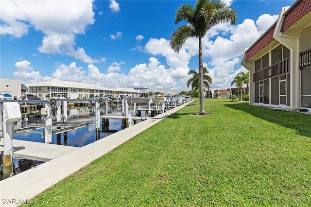 dock area featuring a yard and a water view