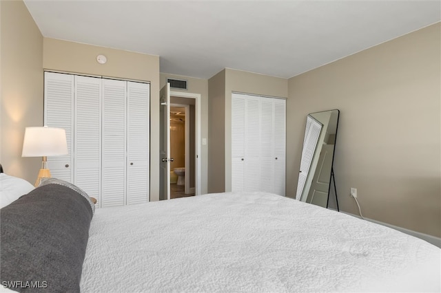 bedroom with multiple closets