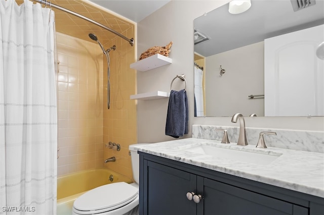 full bathroom featuring vanity, shower / tub combo, and toilet