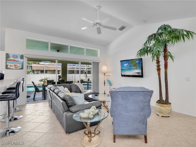 tiled living room featuring vaulted ceiling and ceiling fan