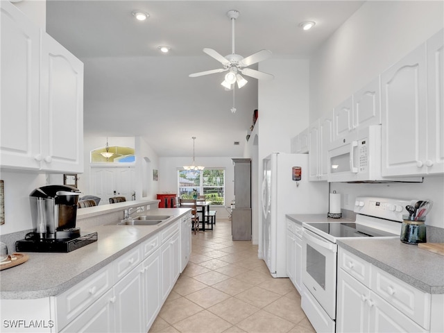 kitchen featuring white appliances, sink, ceiling fan, white cabinets, and light tile patterned flooring