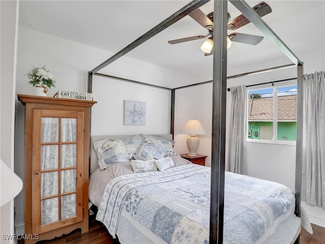 bedroom with dark wood-type flooring and ceiling fan