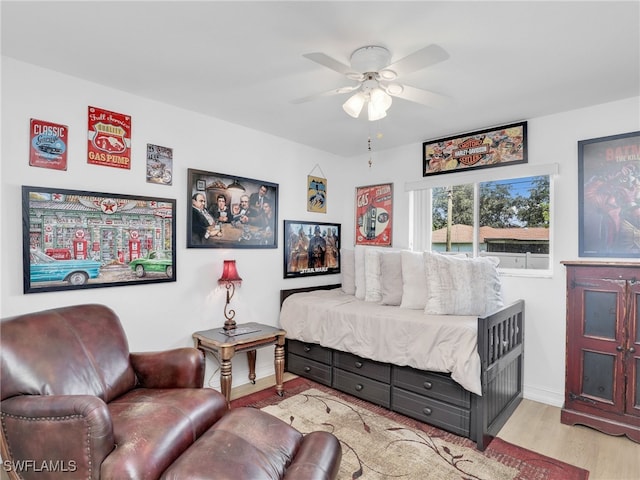 bedroom with light wood-type flooring and ceiling fan