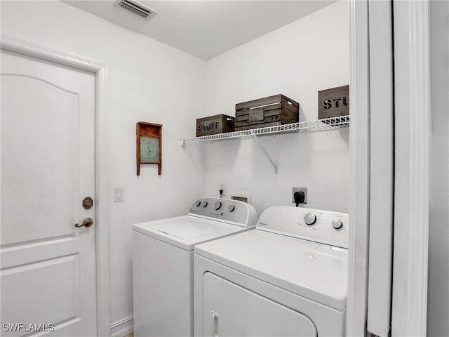 laundry area featuring washing machine and dryer