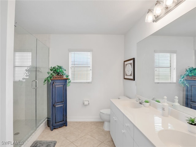 bathroom featuring tile patterned flooring, walk in shower, toilet, and vanity