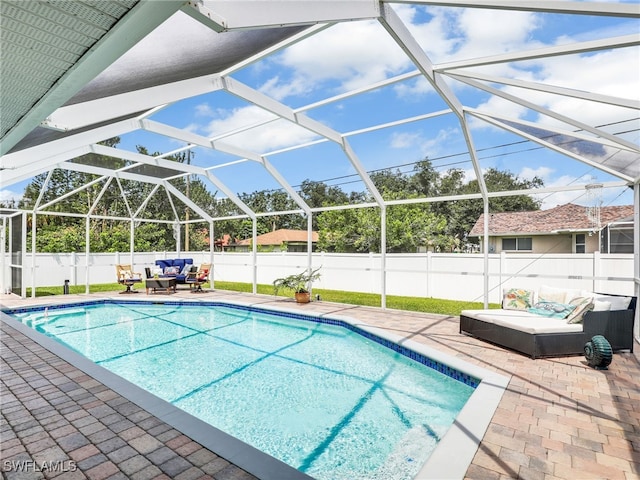 view of pool featuring an outdoor hangout area, a lanai, and a patio area