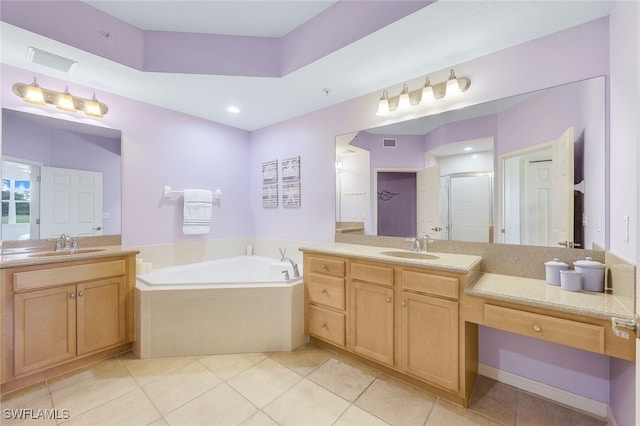 full bathroom featuring a garden tub, tile patterned flooring, two vanities, a sink, and a shower stall