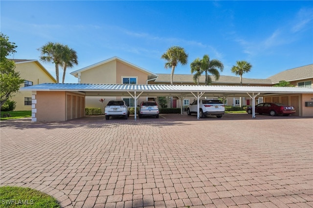 view of car parking featuring a carport