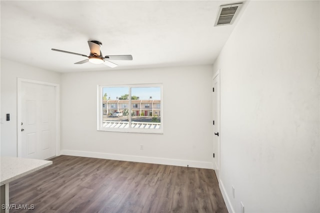 unfurnished room with ceiling fan and hardwood / wood-style flooring