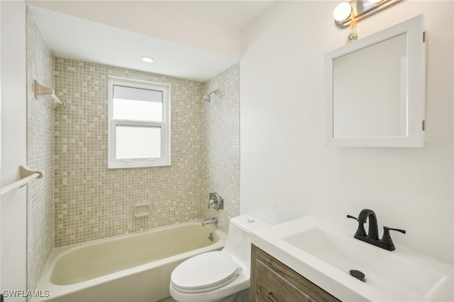 full bathroom with vanity, toilet, and tiled shower / bath