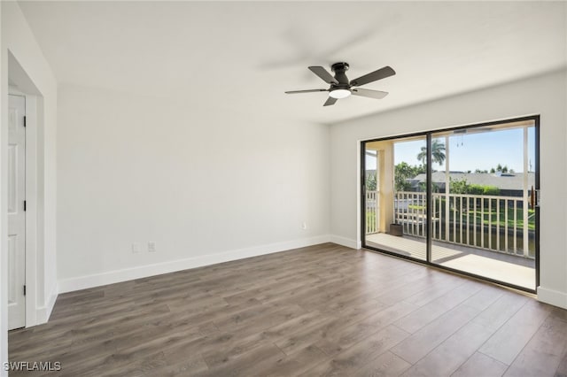 empty room with ceiling fan and hardwood / wood-style flooring