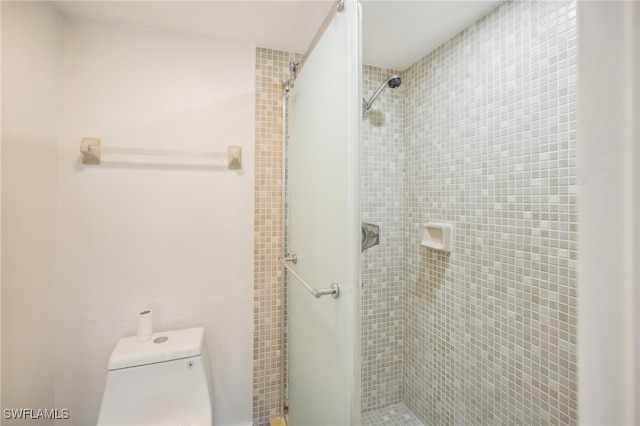 bathroom with toilet and walk in shower