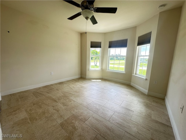 unfurnished room featuring ceiling fan