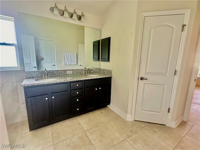 bathroom with tile patterned flooring and vanity