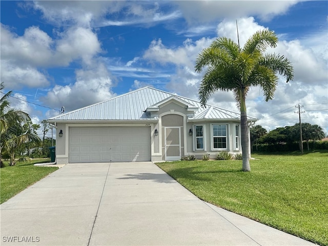 ranch-style home with a garage and a front lawn