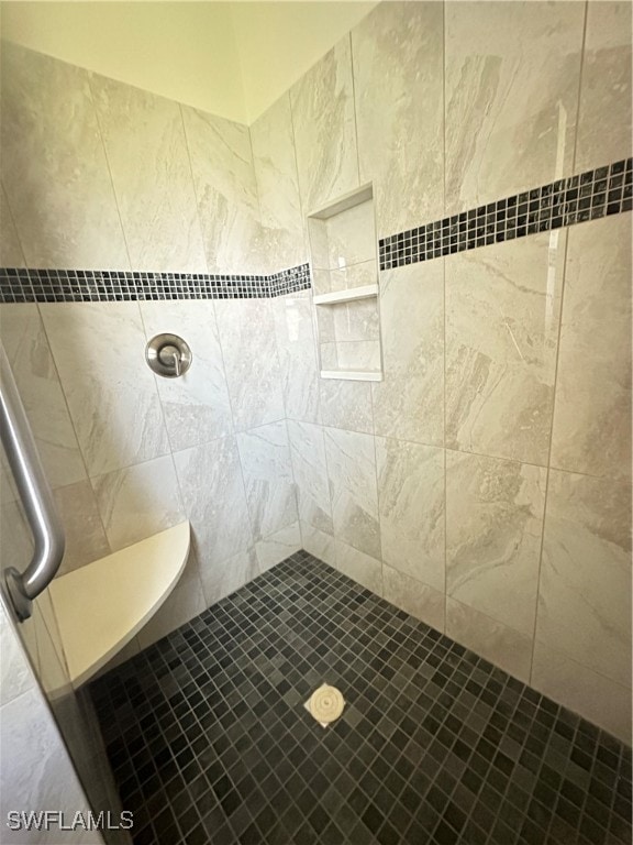 bathroom with tiled shower