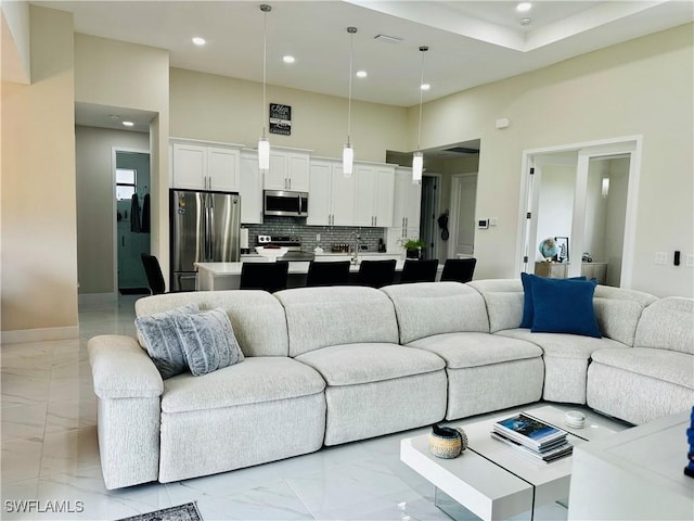 living room featuring a towering ceiling