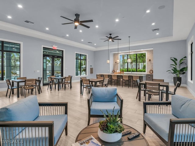 interior space featuring ceiling fan and a tray ceiling