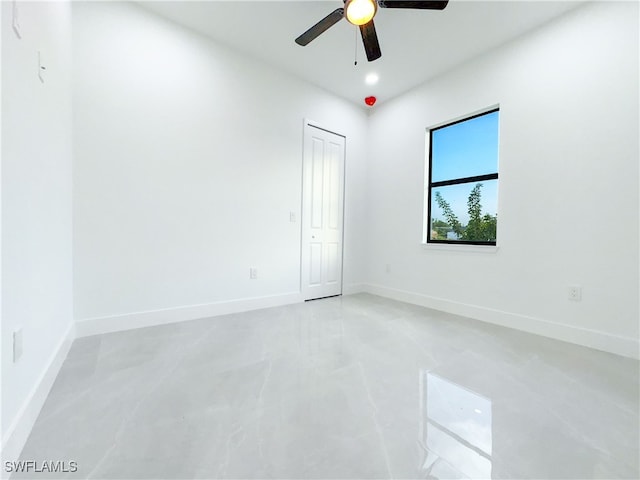 empty room featuring ceiling fan