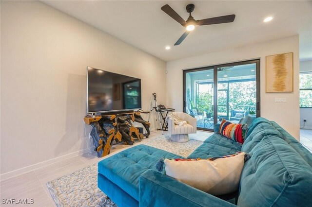 living room featuring light tile patterned floors and ceiling fan