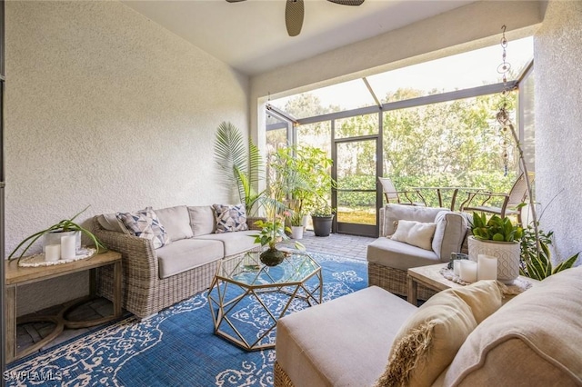 sunroom featuring a ceiling fan